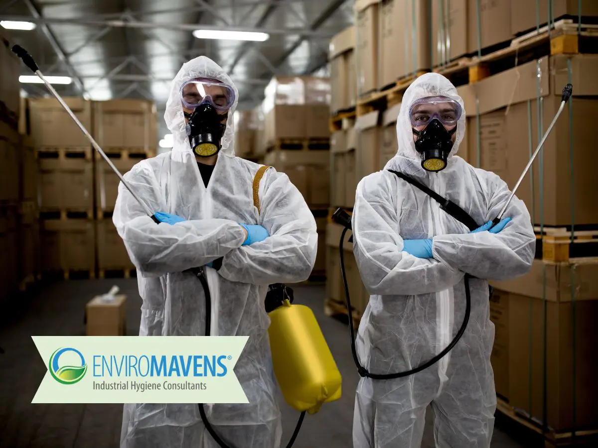 Workers in protective suits with sprayers