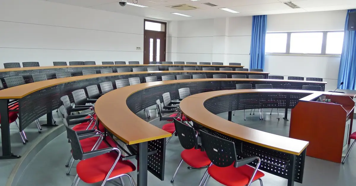 Classroom with red chairs and blue curtains