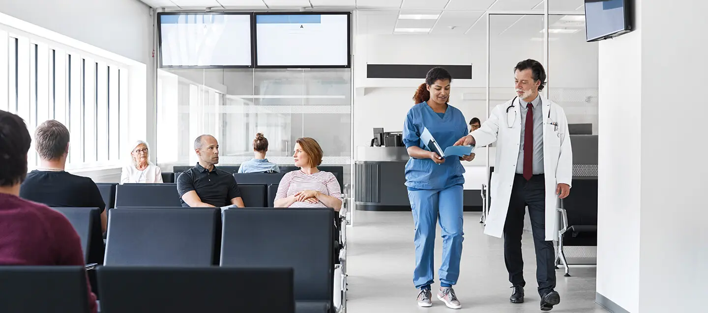 Patients seated in hospital waiting area