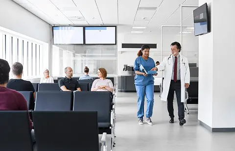 Medical staff walking in waiting area