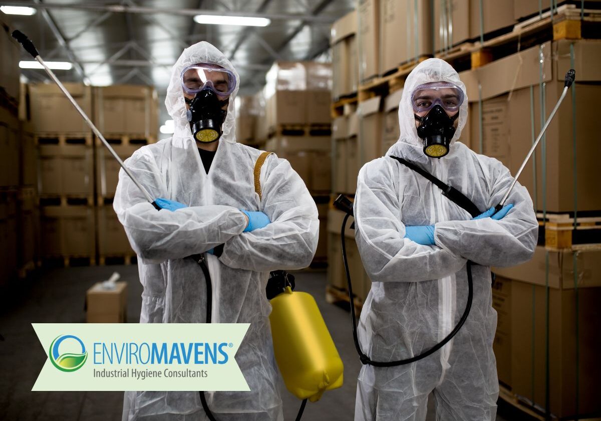 Workers in protective suits with sprayers
