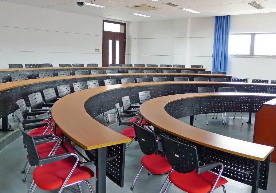Classroom with red chairs and blue curtains